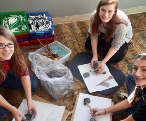 From left: Whitefield Elementary School seventh-graders Emmalee Donahue-Ripley, Hannah Jackson, and Jenna Perkins work with clay in Hollie Hilton's art class. (Photo courtesy Hollie Hilton)