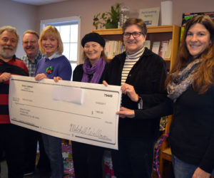 River Company members present a check for $800 to Healthy Kids at the Healthy Kids office in Damariscotta on Wednesday, Dec. 20. From left: Nick Azzaretti, director of River Company's "A Christmas Carol"; River Company Treasurer Mitchell Wellman; River Company Board of Directors members Judy McQuillen and Andrea Handel; Healthy Kids Executive Director Leslie Livingston; and Healthy Kids Board of Directors member Alicia Hunter. (Christine LaPado-Breglia photo)