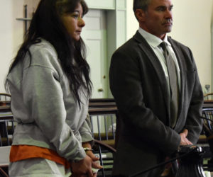 Shawna L. Gatto stands at the defense table with her attorney, Philip S. Cohen, during a hearing at the Lincoln County Courthouse in Wiscasset on Friday, Dec. 15. Gatto faces a charge of murder in connection with the death of her fiance's 4-year-old granddaughter Friday, Dec. 8. (J.W. Oliver photo)