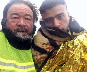 Director Ai Weiwei (left) in "Human Flow." (Image courtesy Amazon Studios)