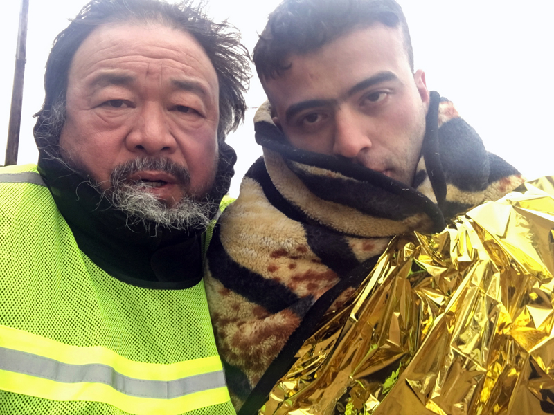Director Ai Weiwei (left) in "Human Flow." (Image courtesy Amazon Studios)