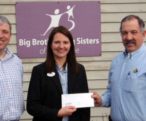 Mid-Coast Energy Systems president Bill Morgner (right) presents a check to Big Brothers Big Sisters of Mid-Maine for $700 from the Christmas ornament auction held during the annual Mid-Coast Energy Systems Christmas party. Accepting the donation on behalf of Big Brothers Big Sisters of Mid-Maine is Executive Director Gwendolyn Hudson and Special Events Coordinator Shawn Doll.