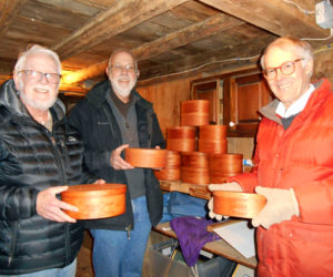 From left: Volunteers Mike Stevens, Bill Thomas, and Bob Ives show the first Shaker-inspired oval boxes.