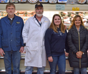 The current and soon-to-be owners of Yellowfront Grocery pose for a photo in the store Monday, Jan. 22. From left: Jeff Pierce, Don Pierce, Steven Pierce, Alexandria Pierce, Jane Gravel, and Gary Gravel. (J.W. Oliver photo)