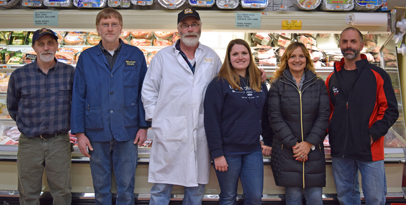 The current and soon-to-be owners of Yellowfront Grocery pose for a photo in the store Monday, Jan. 22. From left: Jeff Pierce, Don Pierce, Steven Pierce, Alexandria Pierce, Jane Gravel, and Gary Gravel. (J.W. Oliver photo)