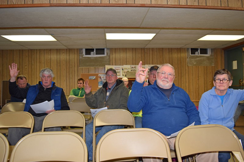 A small group of Edgecomb voters approve the appropriation of $35,678 from surplus to cover storm cleanup during a special town meeting at the town hall Tuesday, Jan. 16. (J.W. Oliver photo)