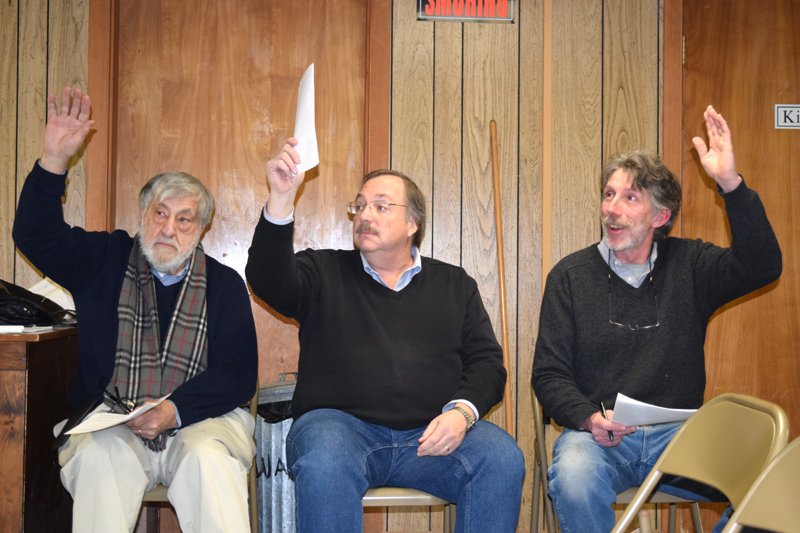 From left: Edgecomb Selectmen Jack Sarmanian, Ted Hugger, and Mike Smith vote to spend $200 from surplus for soil testing on a town property during a special town meeting at the town hall Tuesday, Jan. 16. (J.W. Oliver photo)