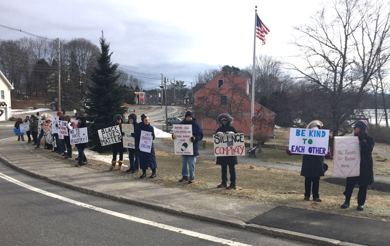 Participants in an anti-racism vigil hold signs along Main Street in Newcastle on Martin Luther King Jr. Day, Monday, Jan. 15. (Photo courtesy Lindy Gifford)