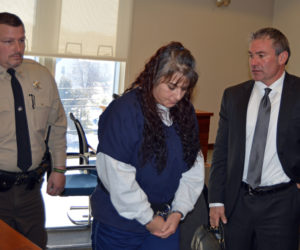 Lincoln County Sheriff's Deputy James Read and defense attorney Philip S. Cohen flank Shawna L. Gatto during a court appearance in Rockland on Thursday, Jan. 25. (Greg Foster photo)