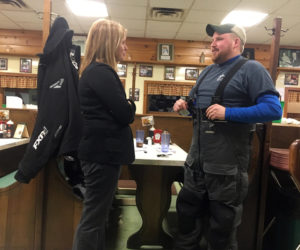 Mary Mayhew speaks with Dustin Delano at Moody's Diner in Waldoboro.