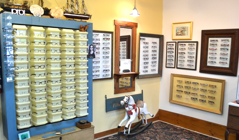 Some of the glasses for sale at Village Optical in Main Street Centre in Damariscotta. Much of the decor was picked out by owner Jane Hall or given to her by clients. (Maia Zewert photo)