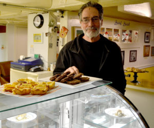 Bernie DeLisle stands behind the display counter at Osteria Bucci, his new eatery in the downtown Damariscotta space formerly home to Paco's Tacos. (Maia Zewert photo)
