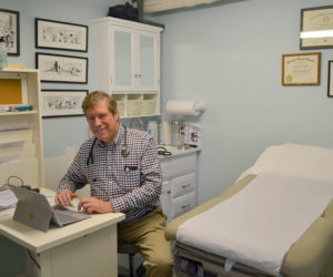 Dr. Allan "Chip" Teel in the examination room of his new medical practice at Hodgdon Green in Damariscotta. Teel recently returned to his work as a primary-care physician. (Maia Zewert photo)