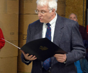 State Rep. Mick Devin reads a legislative sentiment in honor of Lincoln County News staffer Maia Zewert, recipient of the 2017 Bob Drake Young Writer's Award, at the Lincoln County Publishing Co. open house Jan. 17.