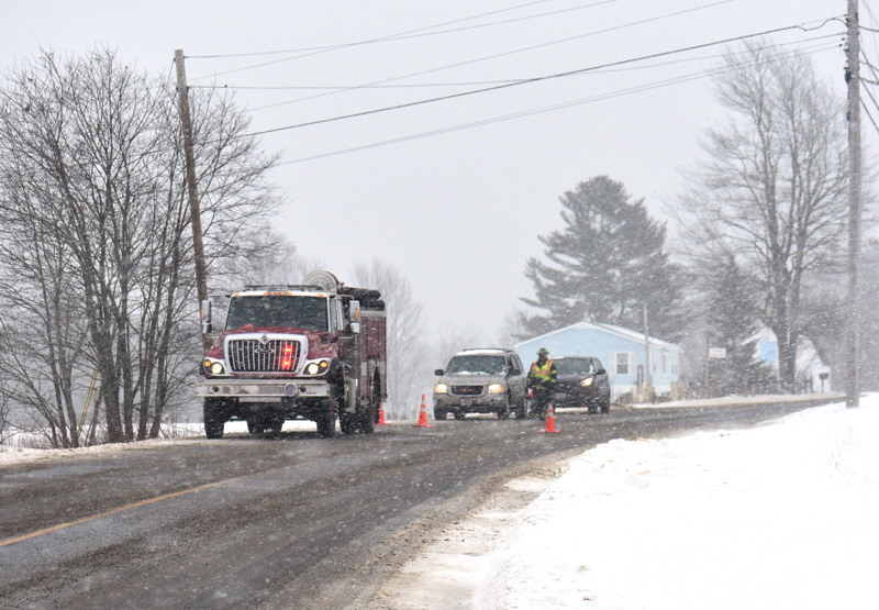 Traffic was stopped while crews removed a vehicle from the side of Route 220 in Waldoboro on Sunday, Feb. 4. There were no injuries in the single-vehicle rollover. (Alexander Violo photo)