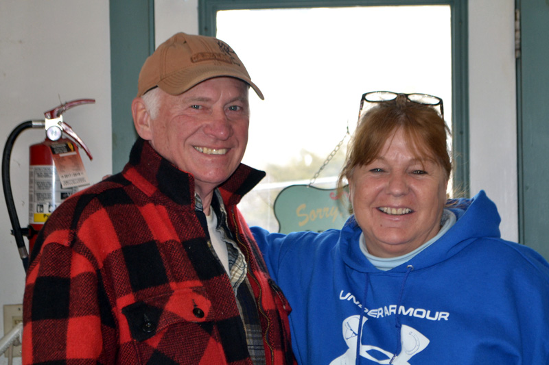 Wiscasset General Store owner Carla Chapman greets customer Merle West. The store will reopen as the Cubbyhole Sports Pub on March 2. (Charlotte Boynton photo)