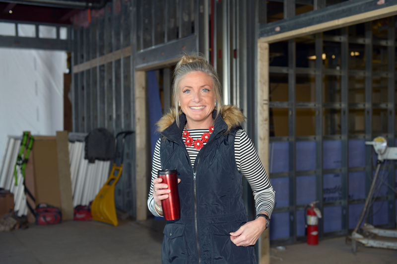 CLC YMCA CEO Meagan Hamblett stands in what will become a community gathering spot, complete with high and low seating and free Wi-Fi. (Paula Roberts photo)