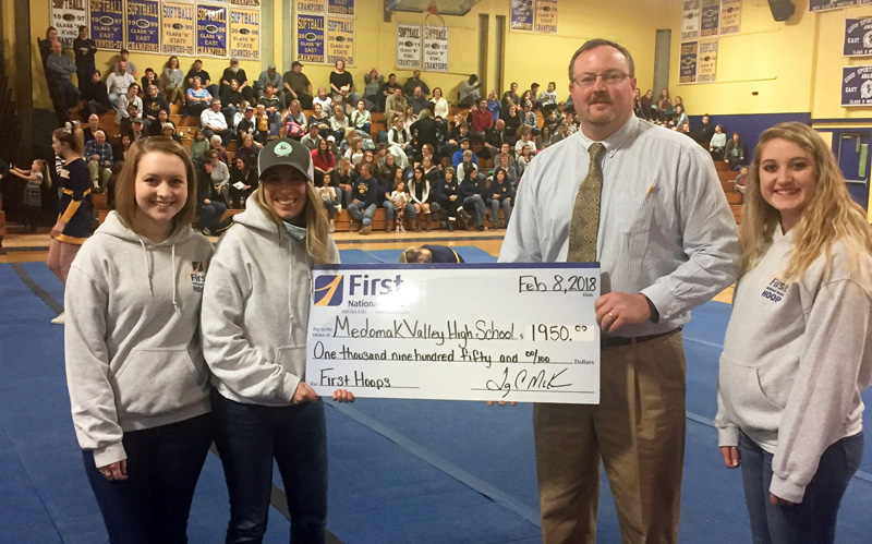 Medomak Valley High School in Waldoboro recieves a First Hoop donation from First National Bank.