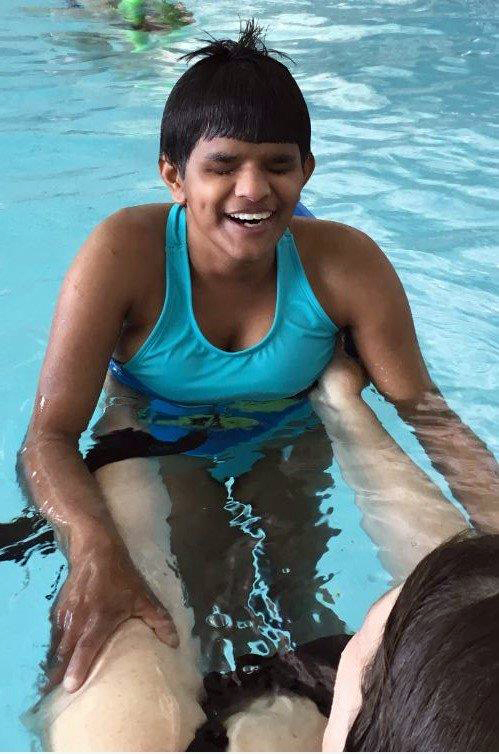 Amrita Plante swims with Heidi Kreft in the Boothbay Region YMCA pool. (Photo courtesy Mobius Inc.)