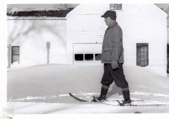 John Glidden heads for his office, 1952, on snowshoes. (Photo courtesy Newcastle Historical Society)