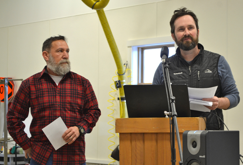 Alna General Store co-owner Ken Solorzano (left) looks on as Jon Villeneuve explains their petition proposing changes to the town's liquor rules during a public hearing Monday, March 12. (Maia Zewert photo)