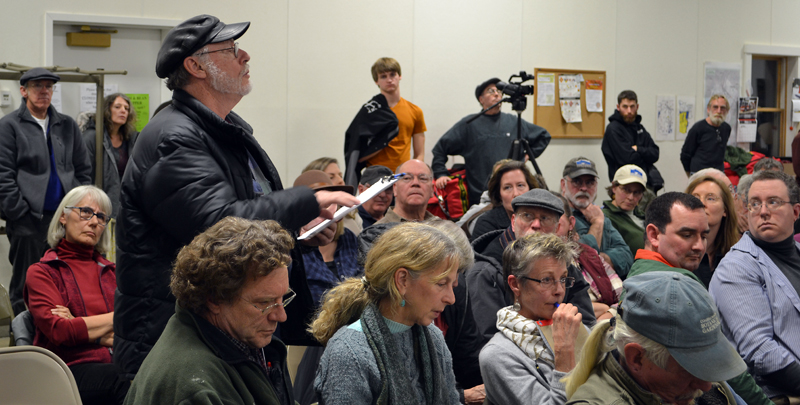 Alna resident Ray Robitaille asks a question about Ed Pentaleri's presentation during a public hearing about the upcoming school choice referendum at the Alna fire station Monday, March 5. (Maia Zewert photo)