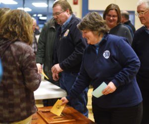 Bristol residents submit a secret ballot on whether they approve hiring a full-time fire chief during the Bristol town meeting Tuesday, March 21. (Jessica Picard photo)