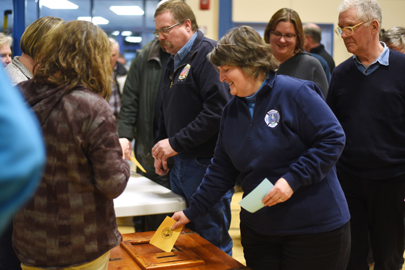 Bristol residents submit a secret ballot on whether they approve hiring a full-time fire chief during the Bristol town meeting Tuesday, March 21. (Jessica Picard photo)