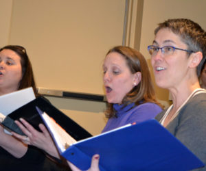 From left: Emily Mirabile, Kristen Robinson, and Victoria Hamilton, who play Judy Bernley, Doralee Rhodes, and Violet Newstead, respectively, in the Lincoln County Community Theater production of "9 to 5: The Musical," sing at a rehearsal Sunday, March 25. Chorus member Barbara Belknap is in the background at right. (Christine LaPado-Breglia photo)
