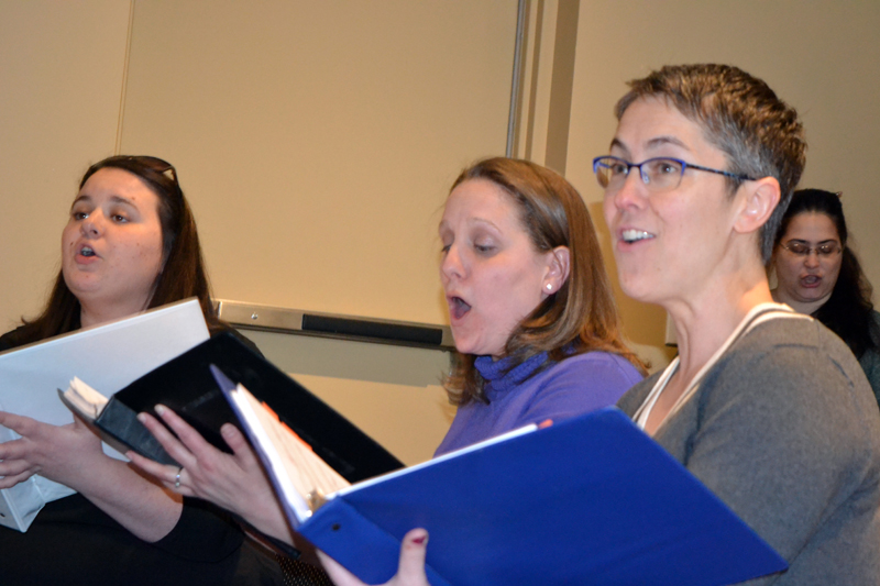 From left: Emily Mirabile, Kristen Robinson, and Victoria Hamilton, who play Judy Bernley, Doralee Rhodes, and Violet Newstead, respectively, in the Lincoln County Community Theater production of "9 to 5: The Musical," sing at a rehearsal Sunday, March 25. Chorus member Barbara Belknap is in the background at right. (Christine LaPado-Breglia photo)