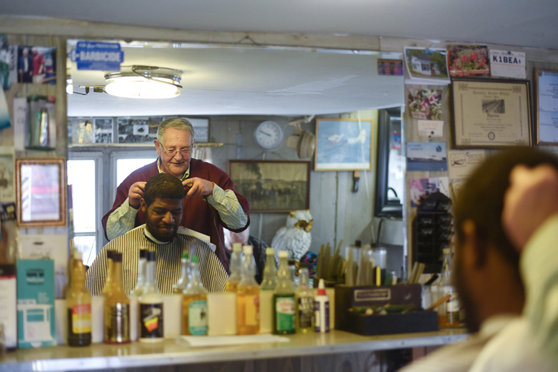 Bruce Soule cuts Darrold Williams' hair at his barbershop in downtown Damariscotta Thursday, March 15. Williams has been getting his hair cut at Bruce's Barbershop for the past 18 years. (Jessica Picard photo)