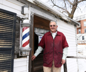 Bruce Soule stands in front of his barbershop in downtown Damariscotta Thursday, March 15. Soule has been cutting hair there for 36 years. (Jessica Picard photo)