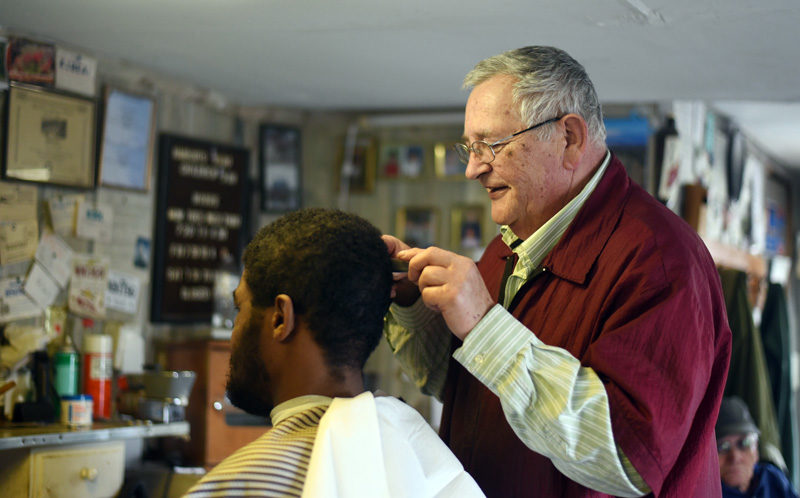 Bruce Soule cuts Darrold Williams' hair at his barbershop in downtown Damariscotta Thursday, March 15. Williams has been getting his hair cut at Bruce's Barbershop for 18 years. (Jessica Picard photo)