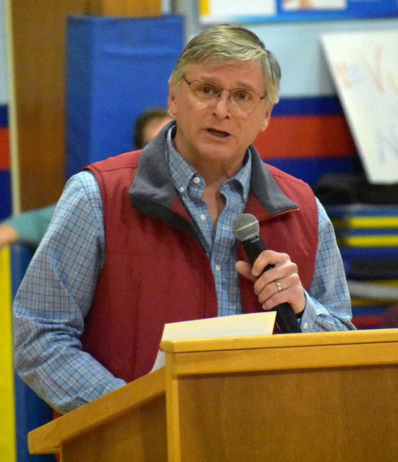 Lincoln County Democratic Committee Chair Chris Johnson welcomes voters to a caucus at Great Salt Bay Community School in Damariscotta on Sunday, March 4. (Alexander Violo photo)