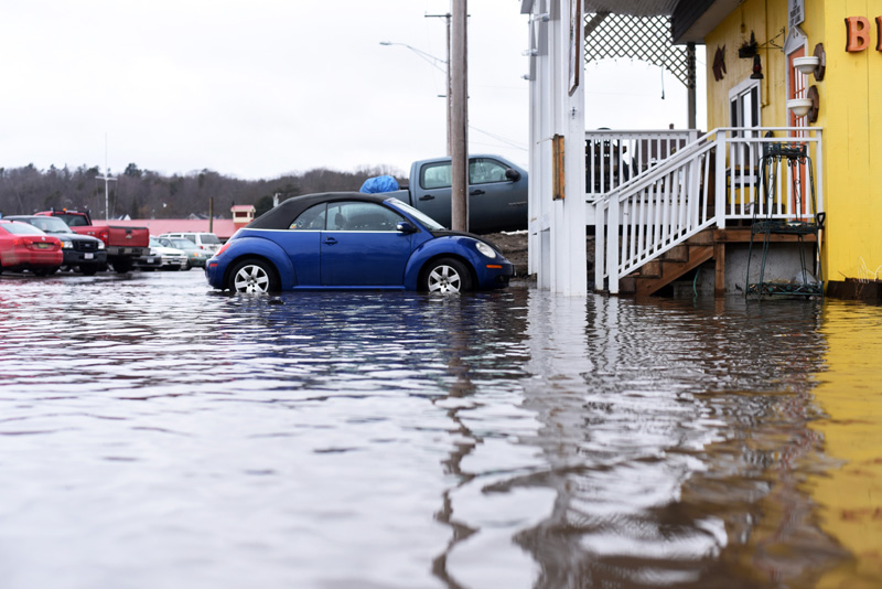 The water reaches the steps of Van Lloyd's Bistro in the municipal parking lot of downtown Damariscotta on Friday, March 2. (Jessica Picard photo)