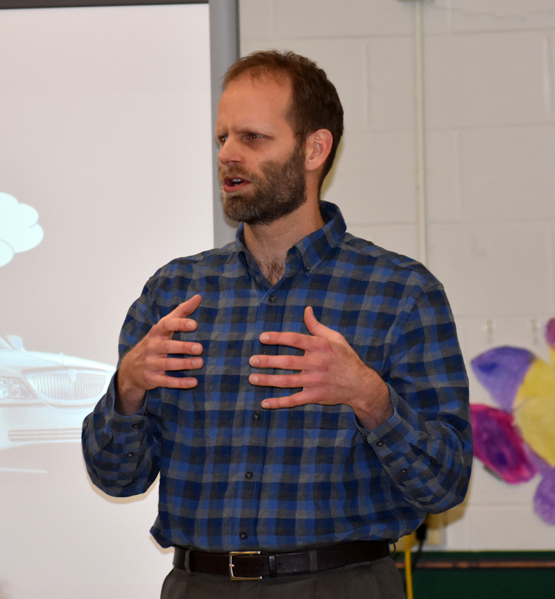 Garret Martin, of Newcastle, presents the results of AOS 93's survey about Lincoln Academy during a meeting at Great Salt Bay Community School in Damariscotta on Thursday, March 15. (Alexander Violo photo)