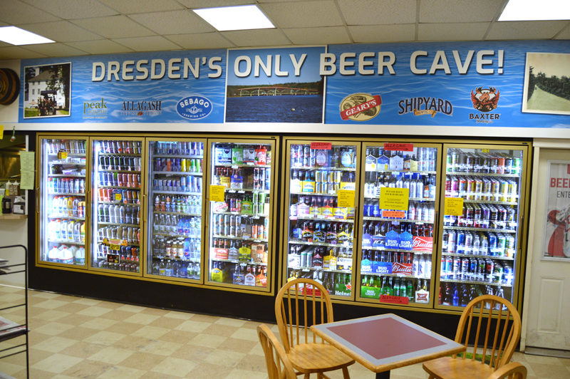 A sign at the Dresden Take Out boasts of "Dresden's only beer cave!" (Greg Foster photo)