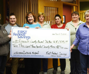 The Lincoln County Animal Shelter accepts a donation from First Federal Savings in memory of Anita Hodgdon. From left: Tammy Walsh and Katie Buehrer, of the shelter; First Federal Savings Vice President Jean Huber; and bank employees Laurie Simmons, Nichole Whitney, Sylviann Ward, and Sunni Gail Page. (Jessica Picard photo)