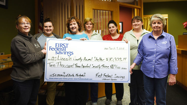 The Lincoln County Animal Shelter accepts a donation from First Federal Savings in memory of Anita Hodgdon. From left: Tammy Walsh and Katie Buehrer, of the shelter; First Federal Savings Vice President Jean Huber; and bank employees Laurie Simmons, Nichole Whitney, Sylviann Ward, and Sunni Gail Page. (Jessica Picard photo)