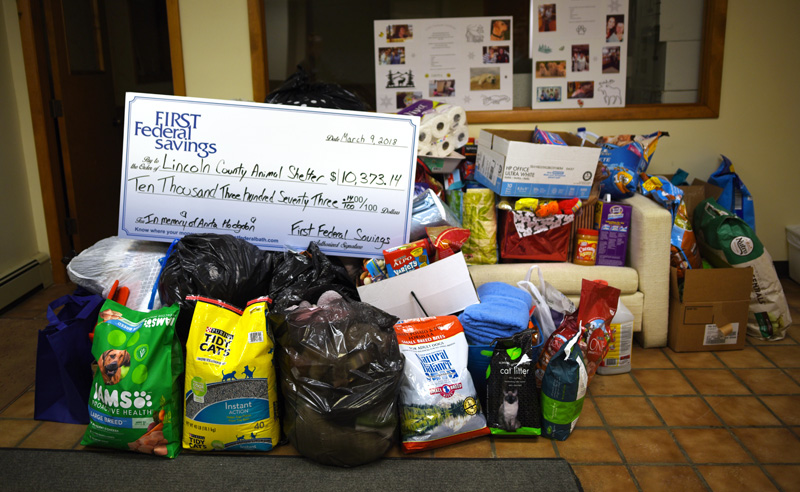 First Federal Savings donated $10,373.14 and animal care supplies to the Lincoln County Animal Shelter in memory of Anita Hodgdon on Friday, March 9. (Jessica Picard photo)