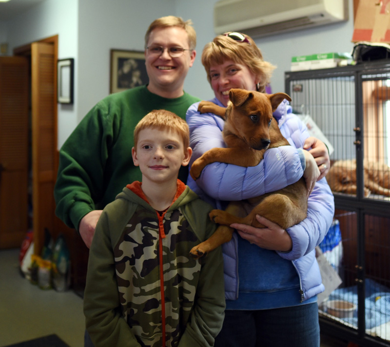 The Mozer family poses for a photo with Cub, the 12-week-old puppy they adopted during the Puppy Palooza event at the Lincoln County Animal Shelter in Edgecomb on Saturday, March 3. (Jessica Picard photo)