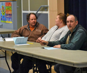The Jefferson Board of Selectmen discusses the upcoming annual town meeting by referendum during a public hearing at Jefferson Village School on Thursday, March 8. From left: Jigger Clark, Pamela Grotton, and Gregory Johnston. (Alexander Violo photo)