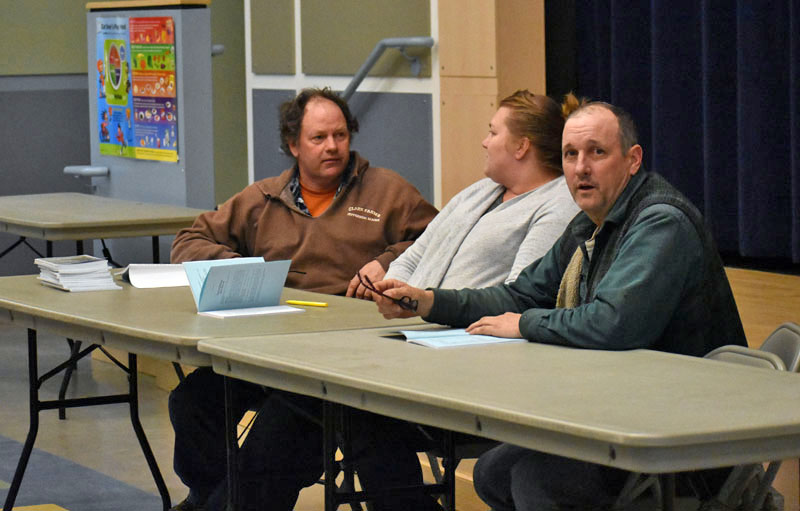 The Jefferson Board of Selectmen discusses the upcoming annual town meeting by referendum during a public hearing at Jefferson Village School on Thursday, March 8. From left: Jigger Clark, Pamela Grotton, and Gregory Johnston. (Alexander Violo photo)