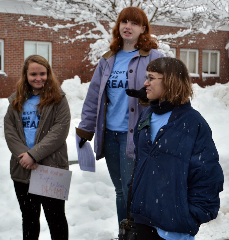 Lincoln Academy senior Hannah Davis (center) speaks during the anti-gun violence walkout at Lincoln Academy the morning of Wednesday, March 14 as Riley Stevenson (left) and Riley Golding look on. (Maia Zewert photo)