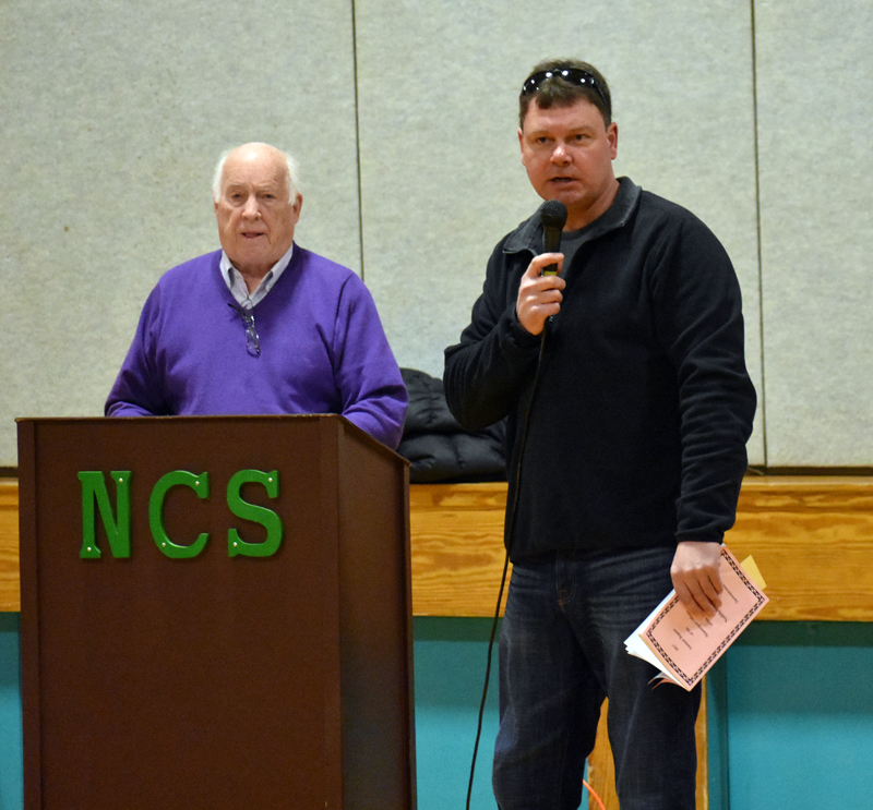 Nobleboro Road Commissioner John York (right) answers questions about upcoming roadwork as Moderator Don Means looks on. (Alexander Violo photo)