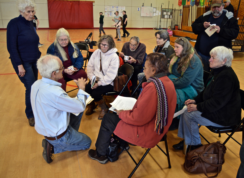 Whitefield Selectman Bill McKeen discusses a survey on recreational marijuana with a small group of residents after adjournment of the annual town meeting Saturday, March 17. (Greg Foster photo)