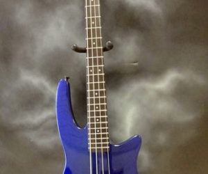 A cobalt-blue NS Wav 4 Radius bass guitar.