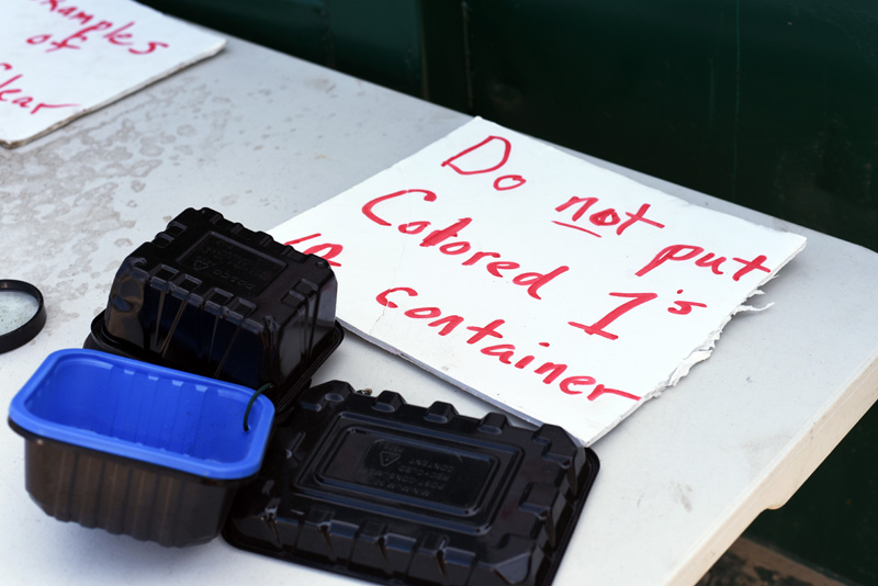 A sign at the Nobleboro-Jefferson Transfer Station, with samples, provides guidance on the type of #1 plastics the station cannot accept for recycling. (Jessica Picard photo)