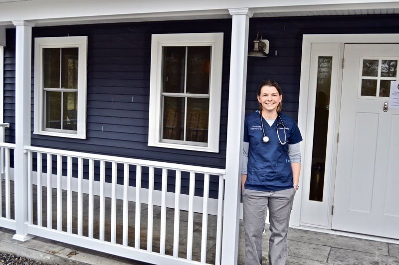 Dr. Susan Bailey stands on the porch that inspired the name of her new clinic, Porchside Veterinary Care, at 514 Gardiner Road in Dresden. (Greg Foster photo)