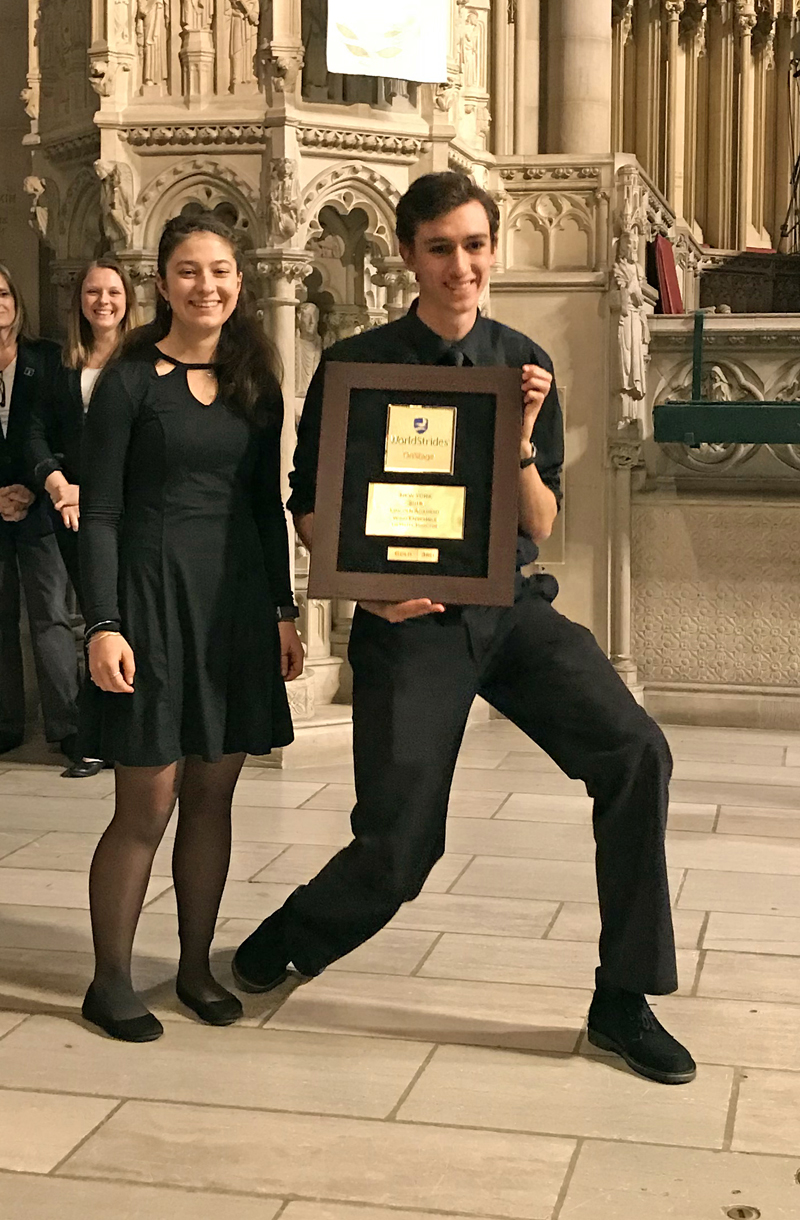 Seniors Emma Allen and Lauren Pusey Nazzaro collect the gold medal from the WorldStrides Heritage Festival judges for the LA Wind Ensembles erformance in New York City.